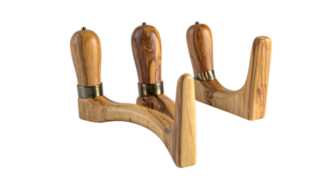 Three wooden massage tools with brass accents, simple design