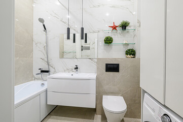 Modern bathroom featuring white fixtures, marble-effect tiles, sleek black accents, and glass...