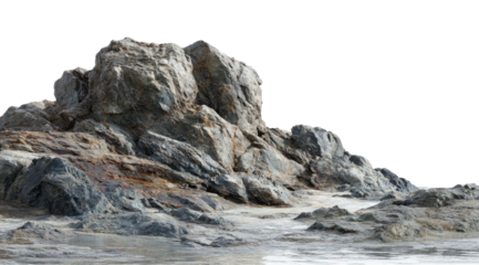 Weathered grey rock formation with sharp edges, resting on a light sandy surface