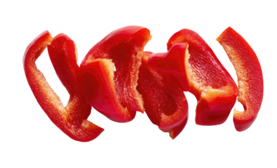 Sliced, vibrant red bell pepper segments against a stark black background, showcasing fresh produce