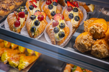 Chocolate nut soufflé with nut topping in a rectangular tray at a pastry shop