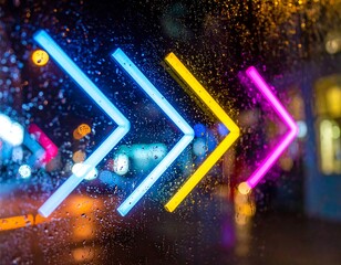 Illuminated directional signs outside on a rainy night