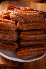 Churros. Fried wheat flour dough, a very popular sweet snack in Spain, Mexico and other countries where it is customary to eat them for breakfast or snack accompanied by hot chocolate or coffee.