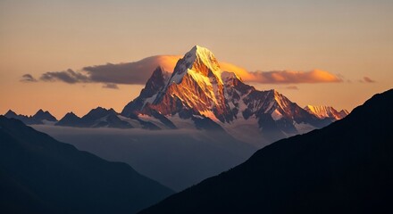 Majestic mountain peak illuminated by golden sunrise light