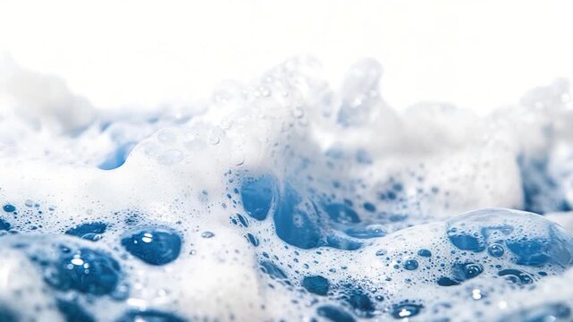 A close-up shot of the foamy surface of water, perfect for use in designs related to ocean, beach, or water activities