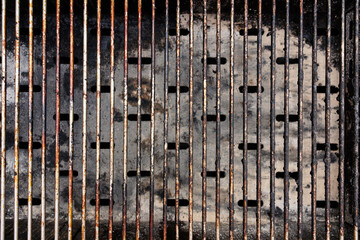 Charred grill grates recall joyful meals outdoors, evoking the warmth of summer days with loved ones.
