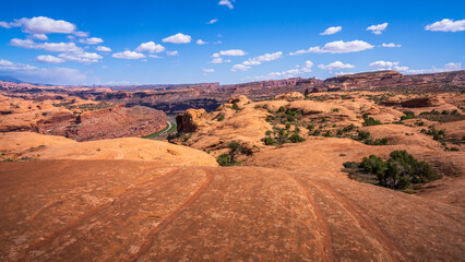 hiking the pothole arch trail near moab in utah, usa