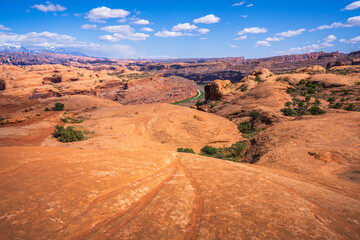 hiking the pothole arch trail near moab in utah, usa