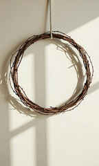 rustic branch arrangement forms delicate minimalist wreath backdrop soft warm natural