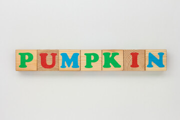 Wooden Blocks Form the Word Pumpkin
