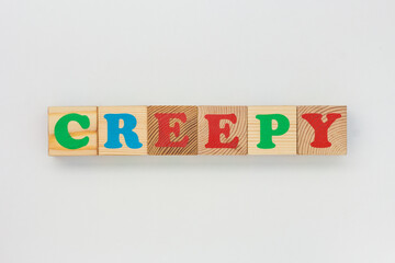 Wooden Cubes Form the Word Creepy