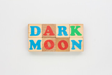 Wooden Blocks Form the Phrase Dark Moon