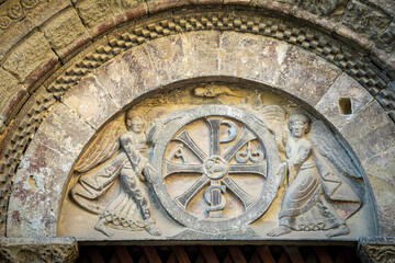 Tympanum of the north portal, Trinitarian chrismon held by two angels, San Pedro el Viejo Monastery, Huesca, Aragon community, Spain