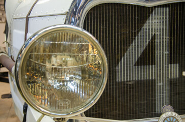 Vintage Car Headlight and Grille Close-Up: Classic Automotive Design
