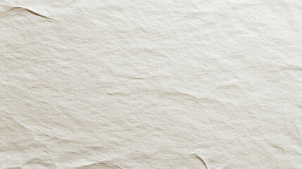 A textured parchment paper of neutral color displays subtle folds, hinting at age or handling. The soft light accentuates the depth of the creases, creating a tactile visual experience.