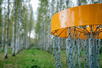 closeup yellow discgolf basket