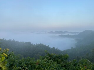 hills with beautiful clouds in the morning. Summer Mountain with green plants and clouds in the...