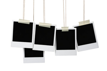Blank polaroid photos hanging with tape, perfect for adding your memories, travel, family, and creative designs, ideal for social media content