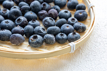 Close-Up of Wild Blueberries in a Wooden Bowl

