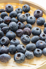 Close-Up of Wild Blueberries in a Wooden Bowl
