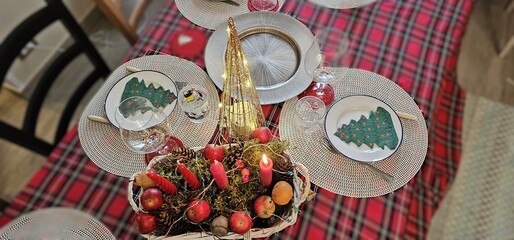 table set and decorated with Christmas decorations to celebrate Holy Christmas and the end of the year
