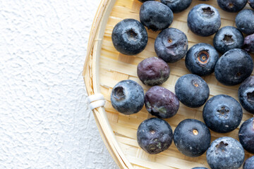 Close-Up of Wild Blueberries in a Wooden Bowl
