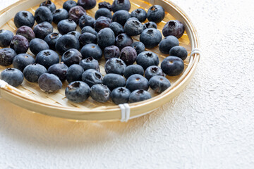 Close-Up of Wild Blueberries in a Wooden Bowl
