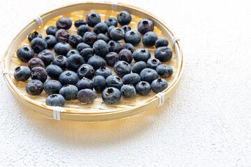 Close-Up of Wild Blueberries in a Wooden Bowl
