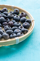 Close-Up of Wild Blueberries in a Wooden Bowl
