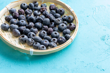 Close-Up of Wild Blueberries in a Wooden Bowl
