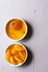 Close-Up of Apricot Jam and Dried Apricots in a Small Bowl
