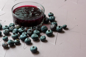 Close-Up of Wild Blueberry Jam with Fresh Blueberries on the Side

