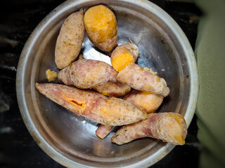 close up of a bowl of boiled sweet potatoes