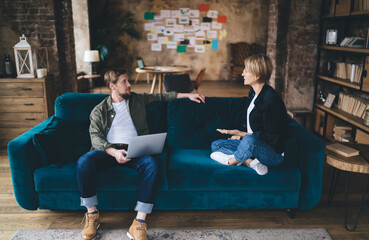 Business duo toasts over laptop screen displaying cloud analytics, celebrating digital KPIs, big‑data success, SaaS growth, tech collaboration, remote teamwork, innovation peak.