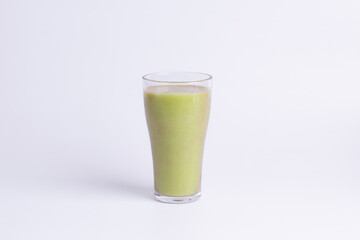 Fresh green avocado smoothie in a tall glass, isolated on white. Represents healthy vegan drink, detox, superfood, summer refreshment, and organic fruit juice.
