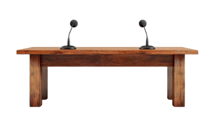 PNG of A wooden table with two microphones, ideal for formal discussions or presentations.