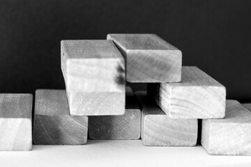 Wooden prisms, forming geometric forms. Close-up background.