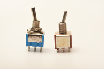 Small electric switches. Electric toggle switch. Blue switches.