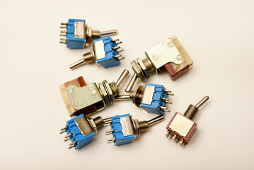 Small electric switches. Electric toggle switch. Blue switches.
