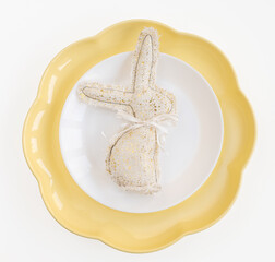 Easter celebration concept. Top view vertical white yellow plate eggs, isolated background, banner