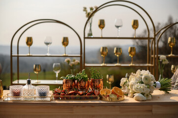 Elegant Outdoor Bar with Cocktails and Flowers