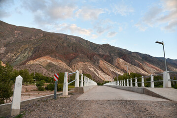 An urban bridge connecting a road to some colorful hills in Jujuy, Argentina. © JF Cimatoribus