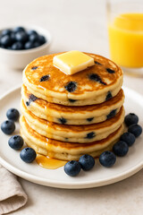 Stack of Blueberry Pancakes with Butter and Syrup breakfast food isolated on a transparent background