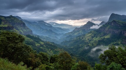 Fototapeta premium The mountains are covered in a thick layer of green foliage, with trees of various sizes and shapes scattered throughout the landscape. The sky above is overcast, with clouds looming low