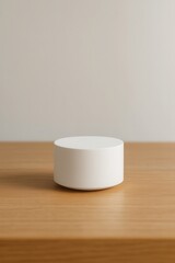 Minimal futuristic smart device on wooden desk in soft natural light
