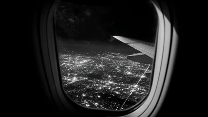 Monochrome aerial view of a vibrant city at night from an airplane window, with glowing lights and wing, travel concept - Powered by Adobe