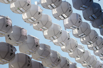 Paper lanterns hang in rows at Jogyesa Temple in Seoul, South Korea © Marquicio