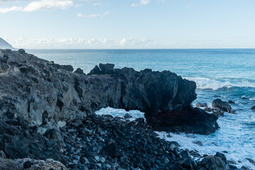 Scenic natural arch along the Kaena Point hiking trail on Oahu, Hawaii	