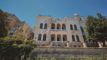 Fototapeta premium Abandoned mansion with decaying facade in Crimea peninsula is showing signs of neglect