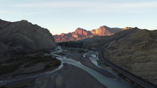 drone shot of sunrise over mountains in tianshan grand canyon, xinjiang, china